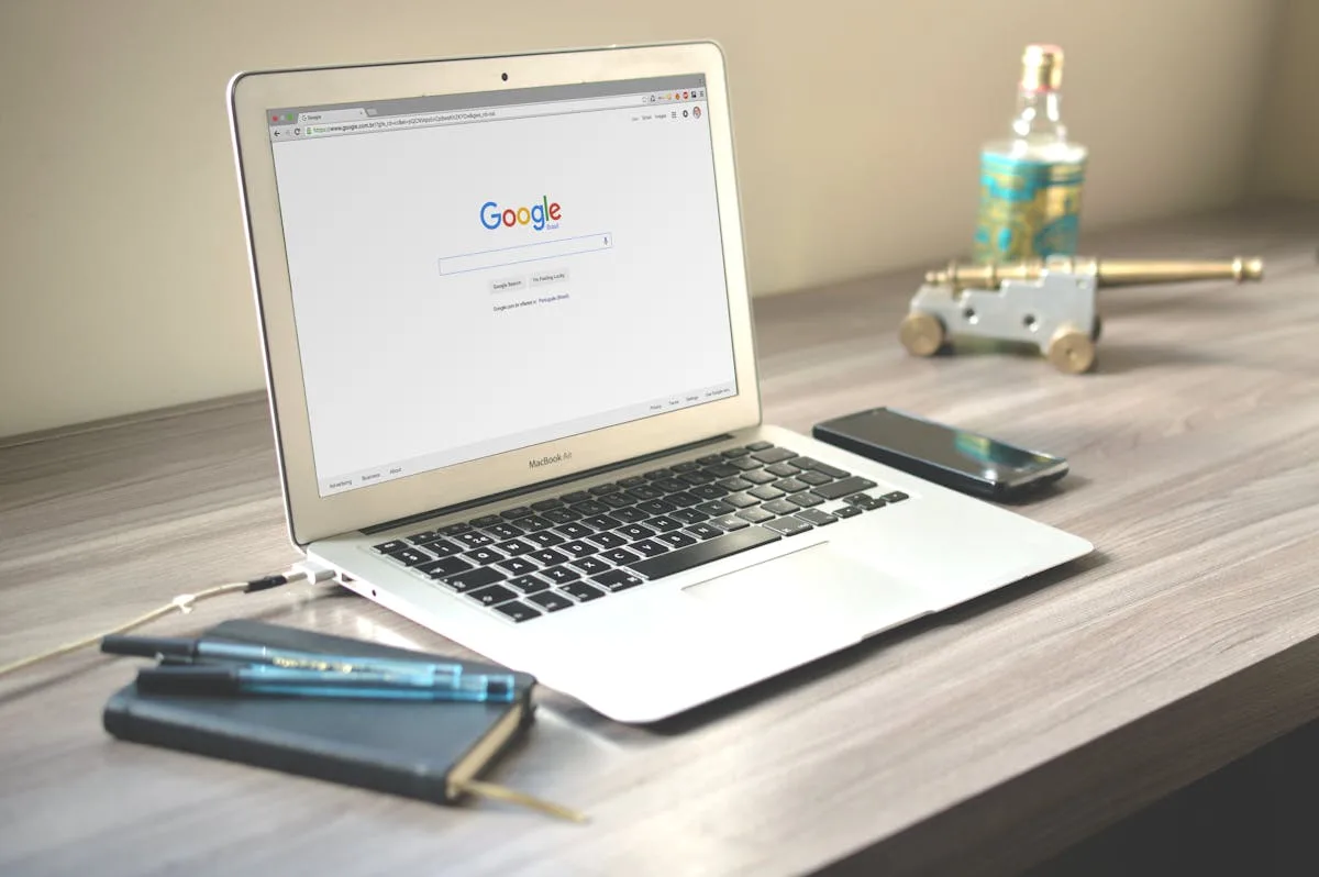 Laptop displaying Google search on a desk