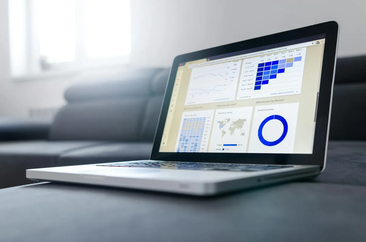 Person reviewing analytics dashboard on laptop